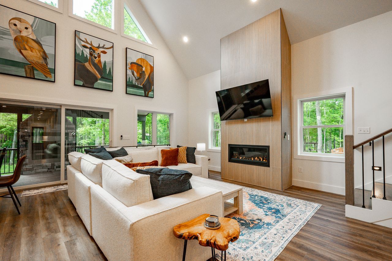 Adirondack — vaulted living room with a fireplace