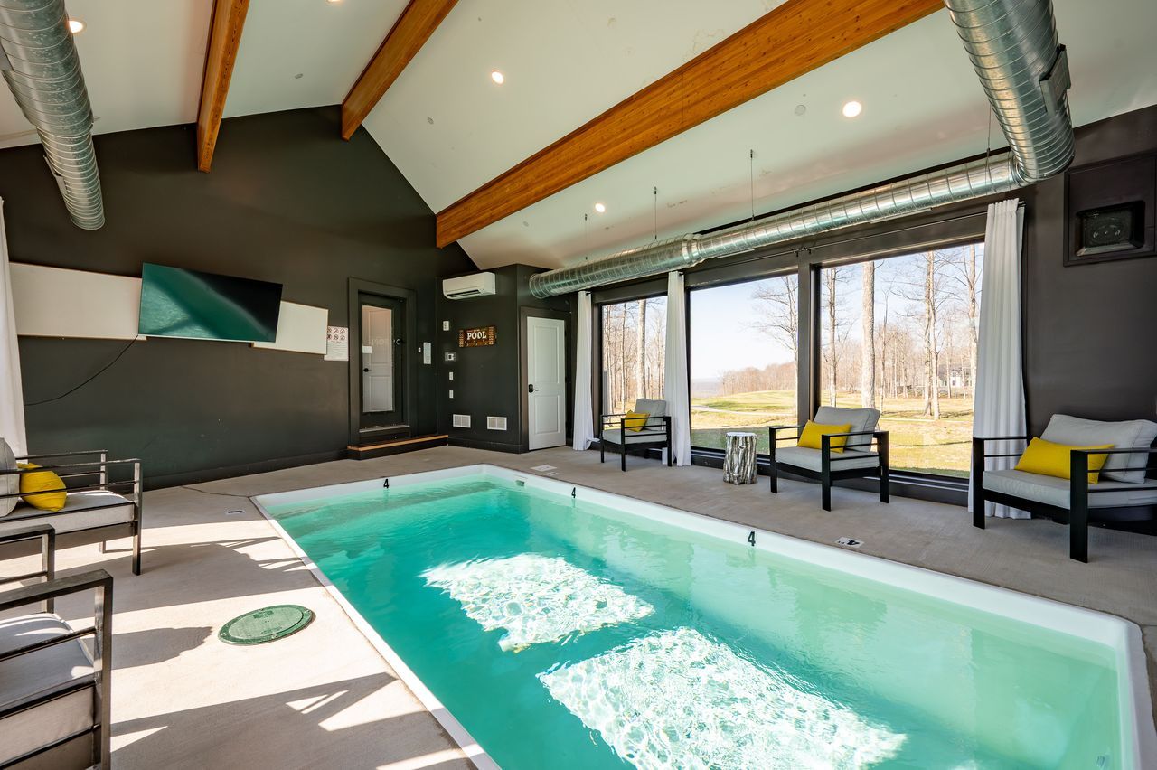Indoor pool under a vaulted, beamed ceiling