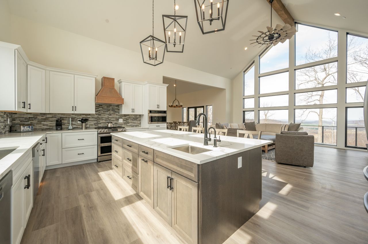 Bright kitchen with a large island and tall windows